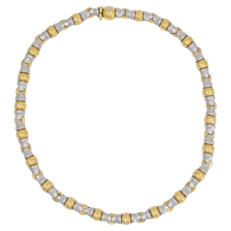 Bvlgari Vintage Bulgari 18k Gold Stainless Steel Collar Necklace: A vintage Bulgari collar necklace made of 18k gold and stainless steel. The necklace features a repeating link design that alternates polished gold elements with stainless steel sections. The mix of