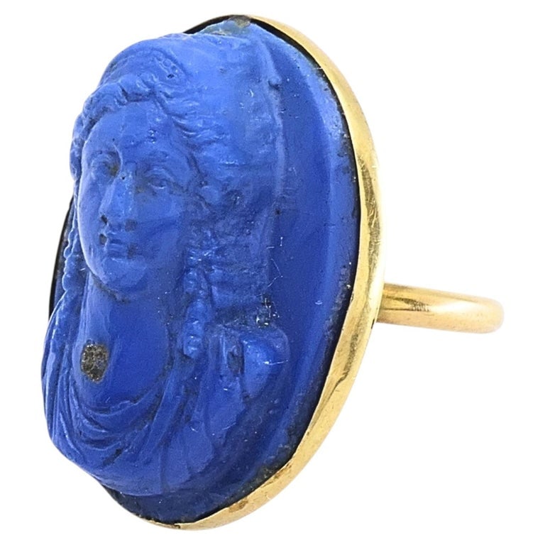 14k Gold Blue Carved Cameo Classical Portrait Ring: This 14k gold cameo ring featuring a carved blue stone with a classical bust in raised relief, set in a simple bezel and framed by a narrow gold rim that follows the stoneâ€™s