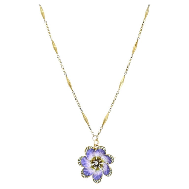 14k Gold Violet Flower Diamond Seed Pearl Pendant Brooch Necklace: An antique-style violet flower pendant / brooch, crafted in 14k gold and suspended from a 14k gold chain. The flower is finished with soft purple enamel petals that show subtle shading and fine vein