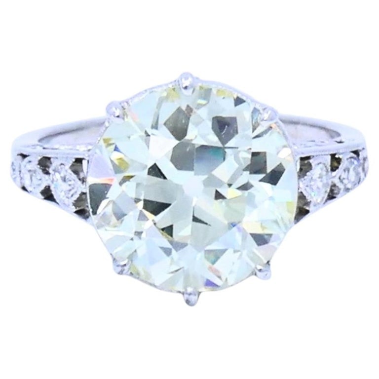 Art Deco Engagement Ring Old European Cut Diamond Platinum Ring Solitaire: This Art Deco platinum ring centers around an Old European cut diamond with a soft, romantic glow and broad facets. The elevated setting highlights the diamond beautifully, while the open-work