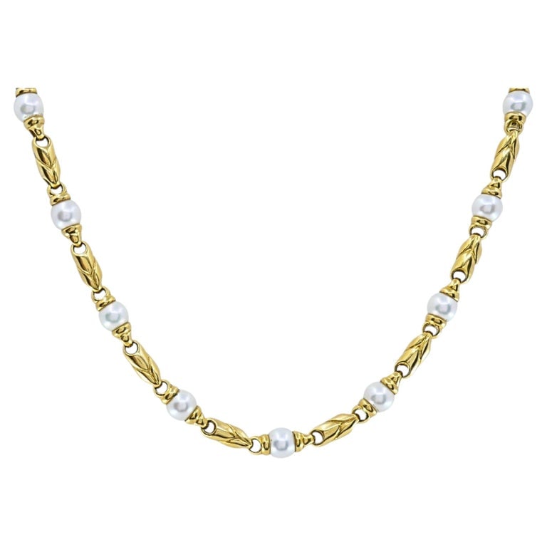 Bvlgari Bulgari Passo Doppio Pearl 18k Gold Link Necklace: DESIGNER: Bulgari CIRCA: 1990s MATERIALS: 18k Gold GEMSTONE: Pearl WEIGHT: 63.4 Grams MEASUREMENTS: 16â€ x 5/16â€ HALLMARKS: BVLGARI, 750, 1970AL ITEM DETAILS: A