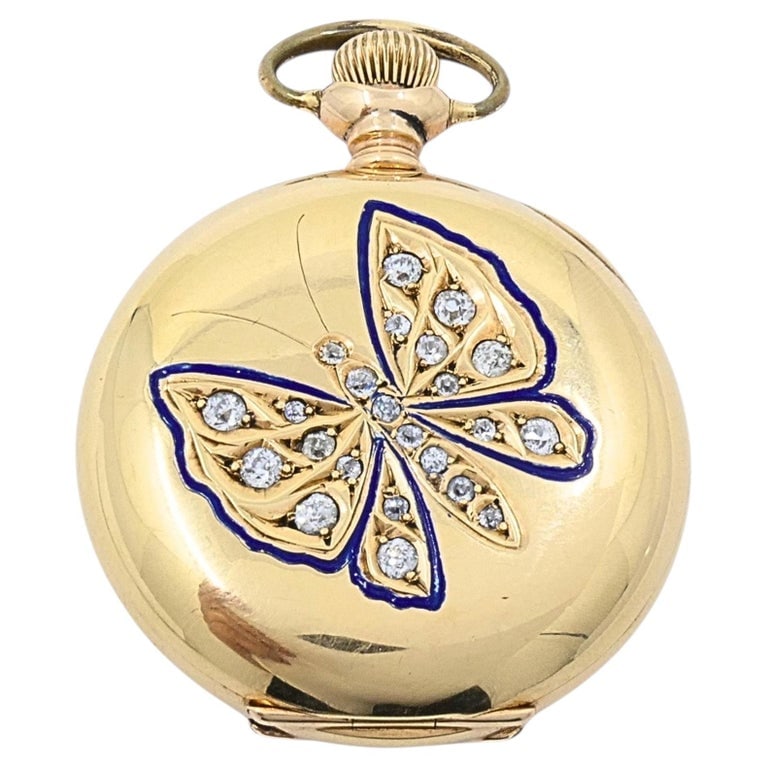 Antique Elgin 14K Gold Keystone Hunter Case Pocket Watch Diamond Butterfly: An antique Elgin ladies pocket watch in 14k gold hunting case by Keystone. The front cover features a butterfly motif outlined in dark blue enamel and set with small round diamonds, giving the case a