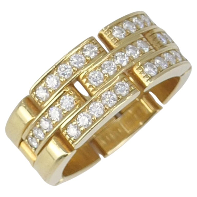 Cartier 18k Gold Diamond Triple Row Maillon Panthere Ring: This Cartier Maillon PanthÃ¨re ring is a signature piece from the French luxury house, featuring the distinctive triple-row link design that simulates the fluid movement of the panther. The