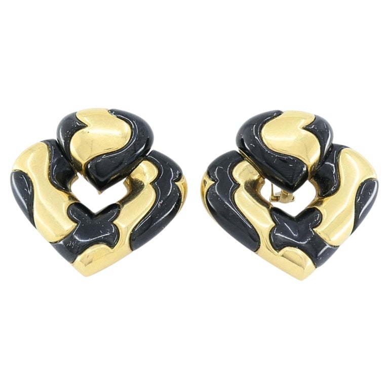 Marina B 18k Gold Black Enamel Heart Earrings Vintage Italian Designer Clip-Ons: DESIGNER: Marina B CIRCA: 1987 MATERIALS: 18K Gold, Enamel WEIGHT: 49.2 Grams MEASUREMENT: 1 3/8" x 1 3/8" x 5/16" HALLMARKS: Marina B, Italy, 750, 1987 ITEM DETAILS: Marina B heart earrings in 18k