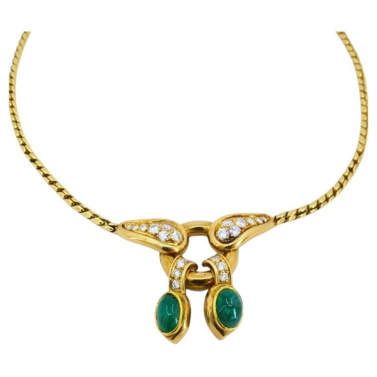 Vintage Rene Boivin 18k Gold Necklace Diamond Cabochon Emerald Estate Jewelry: A vintage RenÃ© Boivin necklace, made of 18k gold and featuring diamonds and cabochon emeralds. It has a structured collar necklace style with a chain that features a smooth, flexible