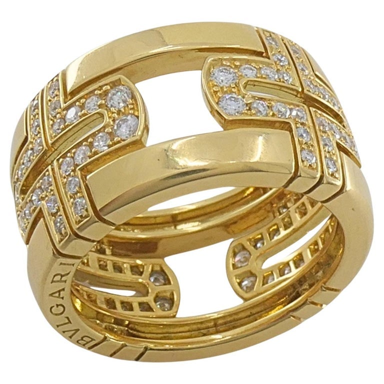 Bvlgari Bulgari 18k Gold Parentesi Diamond Band Ring: Chic and instantly recognizable Bvlgari Parentesi band ring crafted in 18k yellow gold and accented with pavÃ©â€‘set diamonds throughout the iconic openwork Parentesi