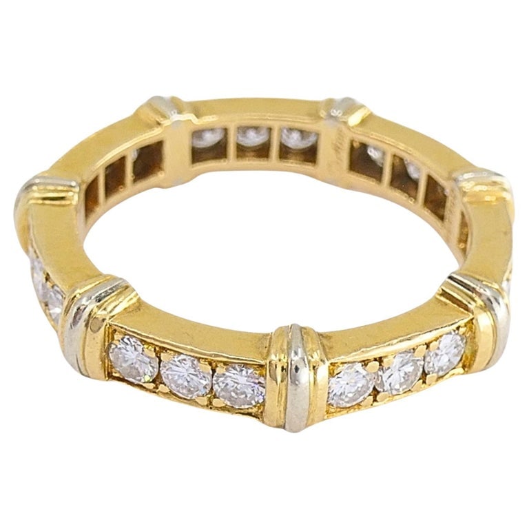Cartier 18k Gold Contessa Diamond Eternity Band Ring: Elegant Cartier â€œContessaâ€ eternity band ring crafted in 18K yellow and white gold and set with diamonds. Sculpted with geometric sections and polished