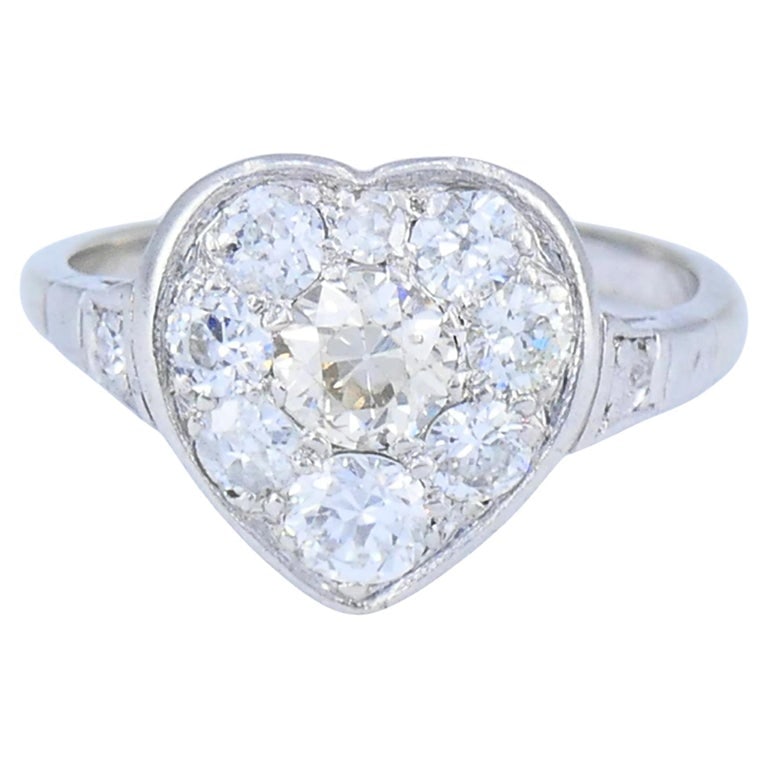 Vintage Art Deco Diamond Heart Cluster Ring 10k Gold Platinum 1930s: This vintage Art Deco diamond heart cluster ring is crafted with a 10k white gold band and a platinum diamond setting, a construction frequently used during the 1930s to provide strength and refined d
