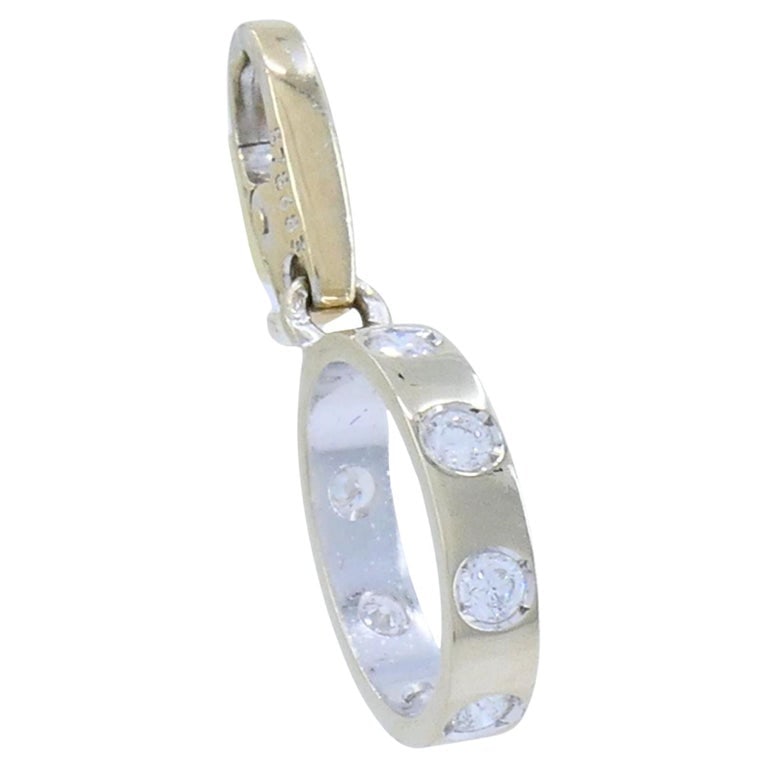 Cartier 18k White Gold LOVE Diamond Oval Charm Pendant: This Cartier Love ring diamond charm pendant is crafted in 18k white gold and designed as a miniature interpretation of the iconic Love ring from the Cartier Love collection. The charm is formed as a
