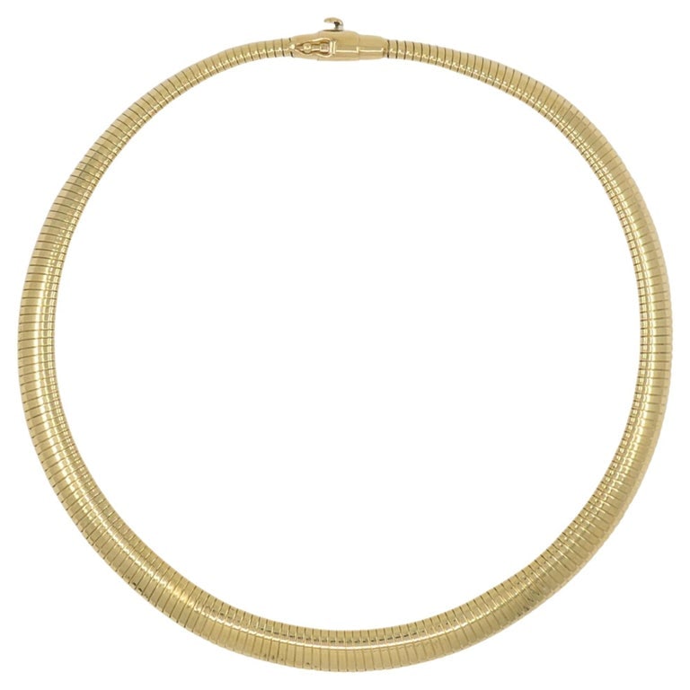 Forstner 14k Gold Necklace Tubogas Style: This vintage Forstner 14k gold necklace features the classic yellow gold tubogas style necklace design. The flexible, ribbed structure creates a smooth, continuous curve and gives the necklace a bold 