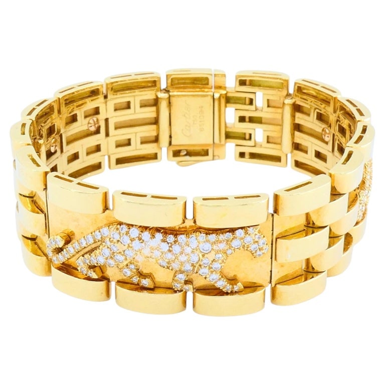 Cartier Walking Panthere Bracelet Mahango Diamond Gold Bracelet: A vintage Cartier Walking Panthere bracelet from the Mahango collection, made in 18k yellow gold and set with diamonds across the signature panther motifs. The design features a series of walking pant
