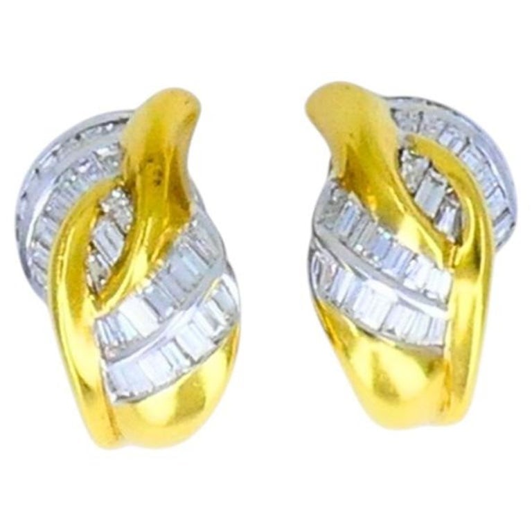 Vintage Luca Carati Diamond Earrings 18k Gold Estate Jewelry: A dazzling pair of vintage Luca Caratiâ€™s diamond earrings made in 18k gold. The earrings feature a curved, interlocking motif that combines polished yellow gold with diamond-set