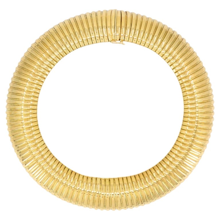 Vintage Tubogas Necklace 14k Gold Italian Collar Necklace: A spectacular 14k gold necklace featuring the iconic Italian tubogas design, known for its flexible, coiled structure and bold presence. The piece is formed from tightly interlocking gold links that