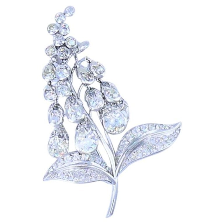 Antique Rene Boivin Platinum Diamond Brooch Circa 1880s Estate Jewelry: This antique Rene Boivin platinum and diamond lily-of-the-valley brooch, dating to the 1880s, captures the natural inspiration that defined early French jewelry design. Shaped as a stylized flowering