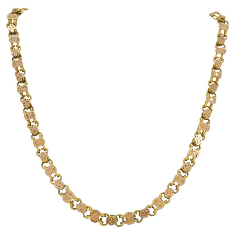 Antique Victorian 14K Two-Tone Gold Ornate Link Chain Necklace: This elegant Victorian-era necklace is crafted in solid 14K gold and features a refined decorative link design with alternating yellow and rose gold plaques, creating a subtle two tone effect along