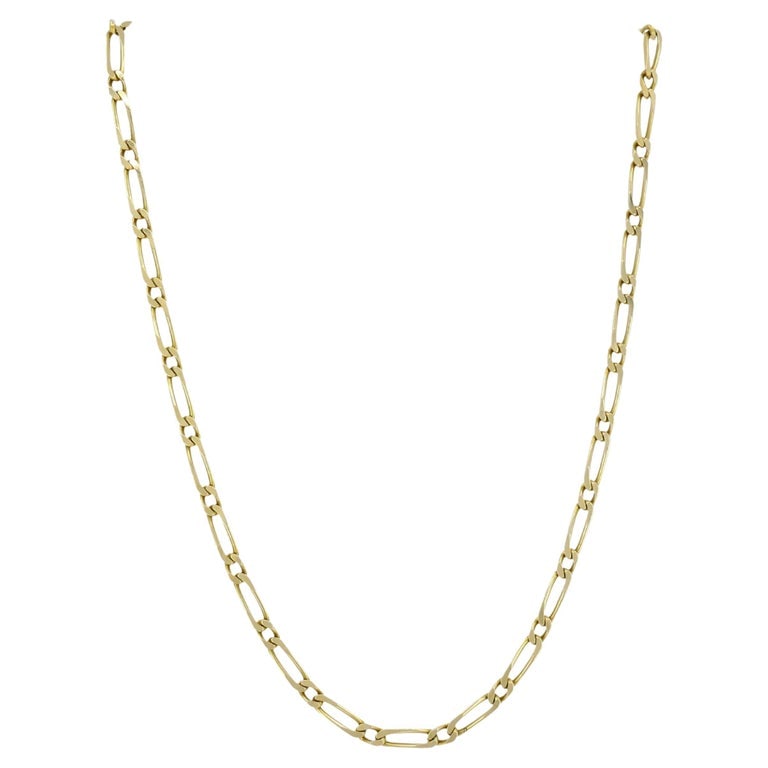 Vintage Chain Necklace French 18k Gold Figaro Link: This vintage French gold necklace is crafted in 18k yellow gold and features a classic chain with Figaro links. The link shape creates a linear look that is easy to style. Each link is smoothly