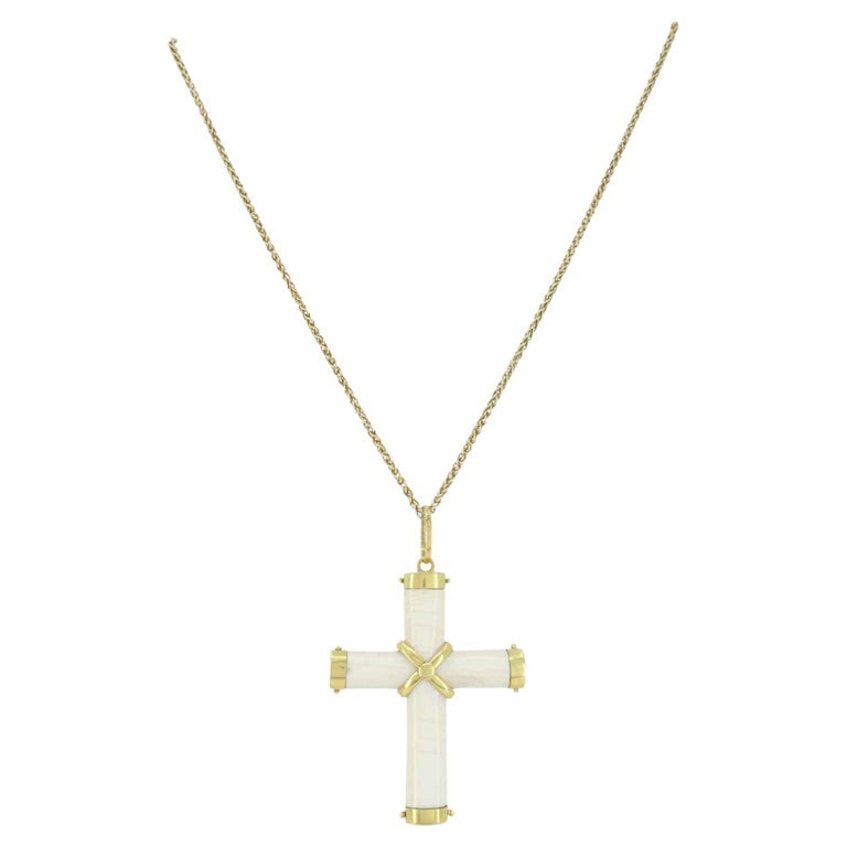 Italian 18K Gold Carved Bone Cross Pendant 14K Gold Chain Necklace: Bone and 18K gold cross pendant paired with a 14K gold chain. The pendant is Italian and dates to the late 20th century, featuring carved bone sections secured in 18K yellow gold caps with a central