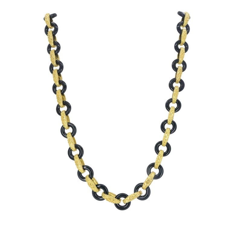 Vintage Tiffany & Co. 18k Gold Onyx Necklace: This Tiffany & Co. onyx and 18k gold necklace reflects the bold, sculptural aesthetic the house favored in the late 1970s through the mid-1980s. Alternating polished black onyx links and textured 18k