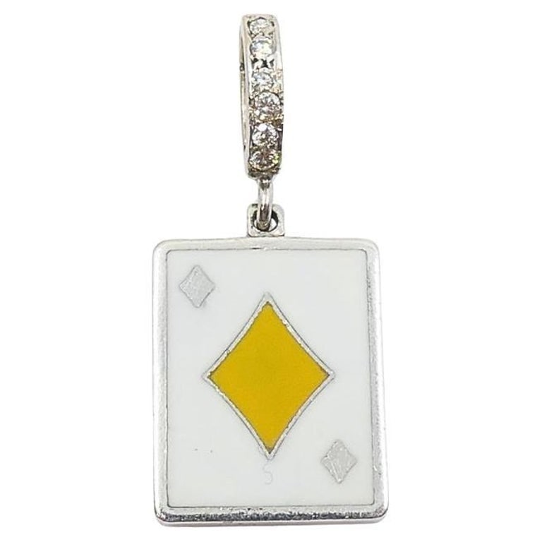 Vintage 12k Gold Playing Card Diamonds Charm PavÃ© Diamond Bail: This vintage charm is crafted in 12k gold and features a playing card design, showcasing the diamonds suit in yellow enamel on a white background. The rectangular pendant measures approximately 7/16"
