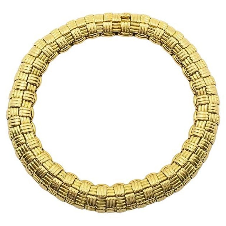 Vintage Cartier Paris 18k Gold Retro Grid Link Bracelet, 1950s-1970s: This vintage Cartier Paris bracelet from the mid-20th century showcases a bold retro grid link design crafted in 18k gold. Measuring 7 1/2 inches long and 5/16 inches wide, and weighing 49.8 grams,