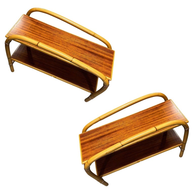 Rattan & Mahogany Double Arch "Tropitan" 2-Tier Side Table by Ritts, Pair: Pair of mid-century one-strand two-tier Double Arch rattan side tables with Mahogany tops part of the "Tropitan" furniture line by the Ritts company. The table features unique copper joints with