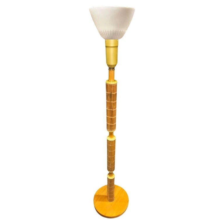 Mid-century Rattan & Brass Floor Lamp w/ Mahogany: This beautifully restored Paul Frankl-inspired Mid-century rattan pole lamp featuring a single rattan pole centered with 3 sections wrapped in brass and stick reed rattan sections and sculpted blond m