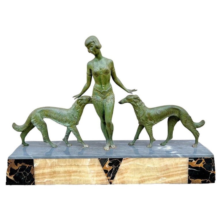 Art Deco Light-up Flapper Bronze Patina Sculpture by Enrique Molins-Balleste: Illuminate your space with this timeless French Art Deco Sculpture and accent lamp showcasing a Bronze Patina Flapper girl with two Borzoi dogs with a green patina fixed to a multi-colored Marble Base