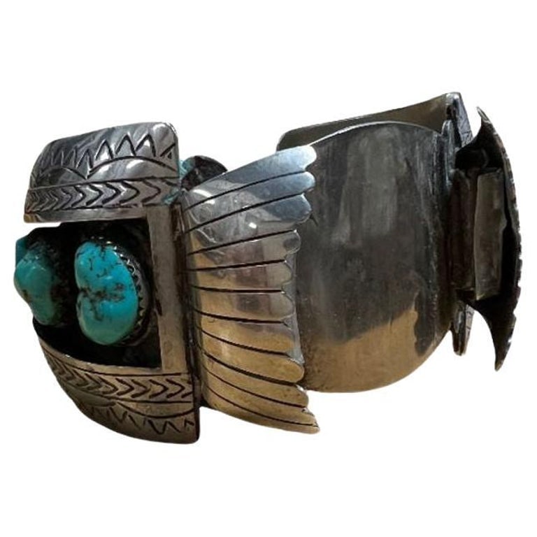 Silver Navajo Watchband Cuff w/ Bisbee Torqouise, Hyson Craig Style: Navajo silversmith watchband/cuff styled after the work made by Hyson Craig, this classic combination of heavy silver and American turquoise stone. The cuff is filled with a magnificent collection of