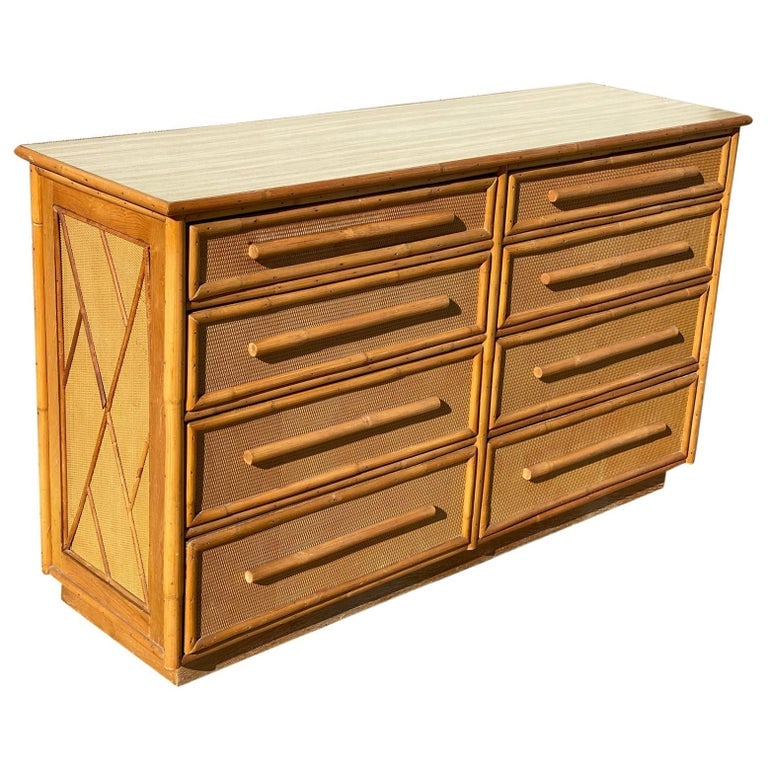 Restored Mid-century Rattan & Wicker Dresser by Mengel Furniture: Original restored Mid-century 6-drawer dresser by Mengel Furniture. The dresser is made with a Formica top with rattan trim decorating woven wicker fronts and poles rattan pulls. This piece combines h