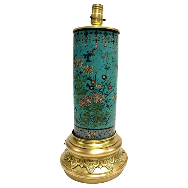 Vintage Cloisonne Inlaid Floral Turquoise Table Lamp: Elevate your living space with this captivating Lamp Table in a rich fusion of brown and turquoise hues. The table exudes a perfect balance of warmth and vibrancy, making it a striking accent piece
