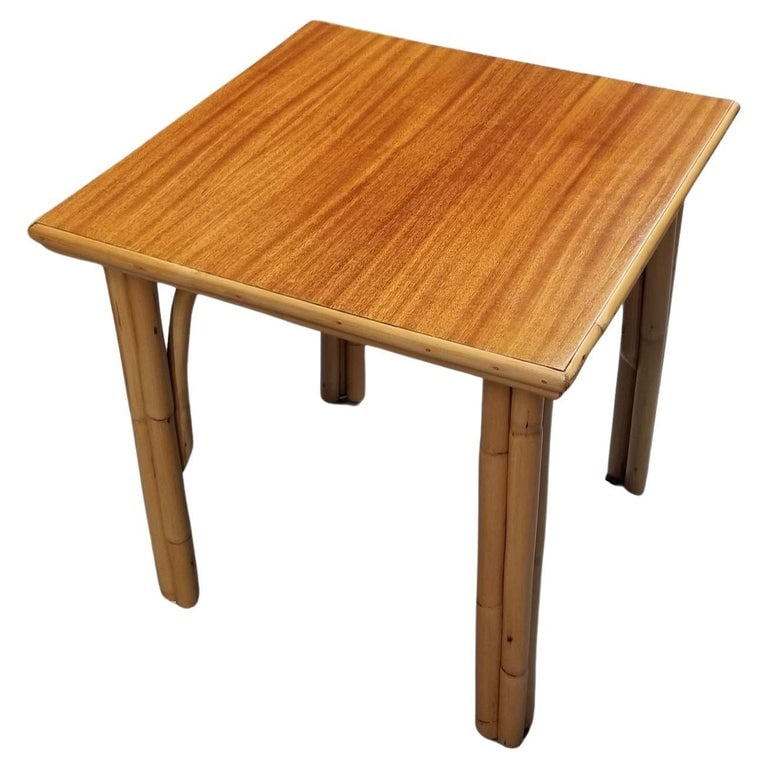 Restored Rattan Three-Strand Arched Legs Side and Drink Table with a Solid Mahog: This beautifully restored Paul Frankl-inspired rattan Three-Strand Coffee Table, featuring gracefully arched legs and a lustrous mahogany top. Its compact, square design makes it ideal for smaller