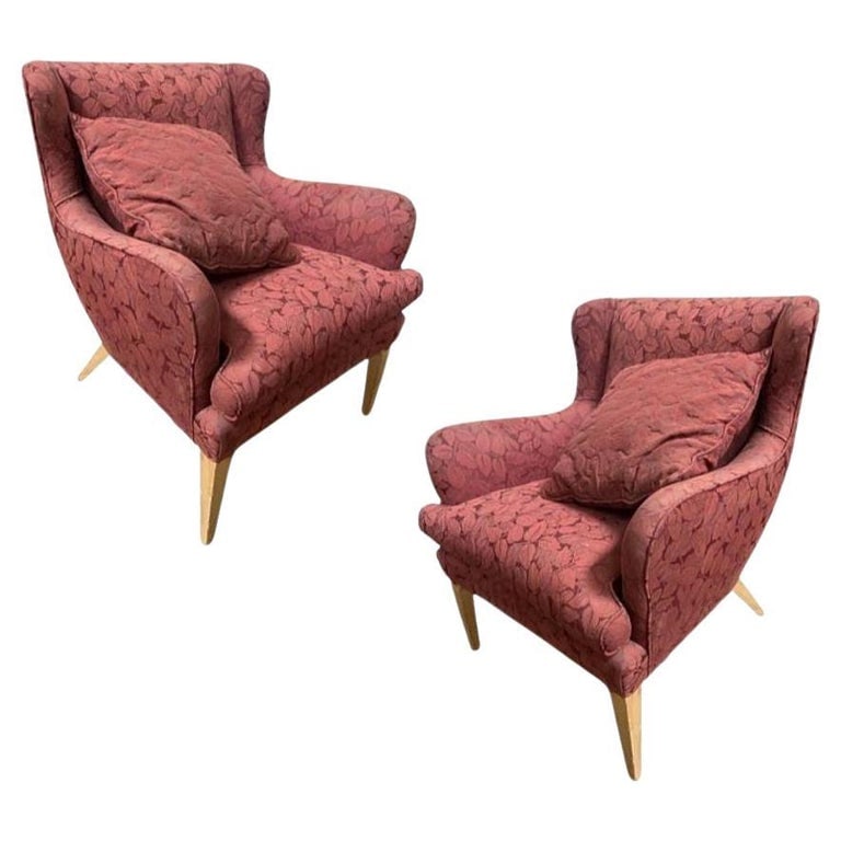 Mid Century Modern Wingback Lounge Chair Burgundy Leaf Print Pair: The Burgundy Wingback Mid-Century Chair is a spacious, stylish blend of vintage and modern design. With its rich burgundy upholstery, curved backrest, and tapered wooden legs, it complements any