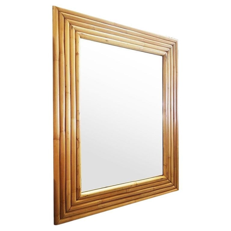 Restored 1948 Seven-Strand Rattan Mirror by Tropical Sun Rattan Co, 3 Available: This beautifully restored 1948 new-stock rattan frame is from the unused stock of Tropical Sun Rattan Company of Pasadena. The Mirror features a 7-strand stacked rattan frame with a 28" tall mirror in
