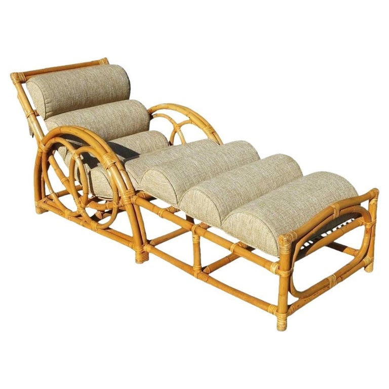 Restored 1949 Circles & Speed Arm Rattan Chaise Lounge Chair: Rattan chaise lounge with what we at the shop call the Circles and Speed Arm, two-strand side arms. Inspired by Paul Frankl this lounge is one of the rarest of all designs. The workmanship is