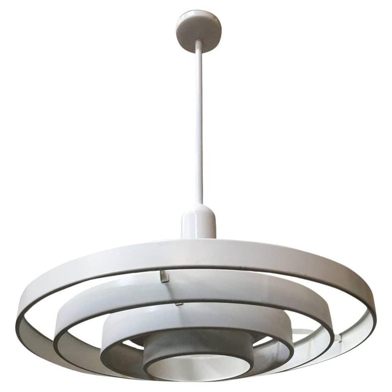 Mid-century "Saturn" Ceiling Steel 20" Pendant by Kurt Versen: Kurt Versen designed "Saturn" ceiling light featuring a stacked steel ring light shade suspended by wire to a focused light socket. Altogether this light fixture is 36" tall perfect for large vaulted 