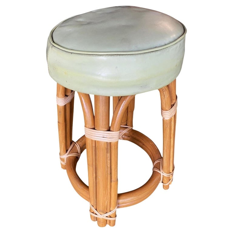 Restored Single Stand Arched Rattan Vanity Stool W/ Teal Seat: Restored Mid-century single stand arched rattan vanity stool with teal vinyl seat 1950, United States We only purchase and sell the best and finest rattan furniture made by the best and most