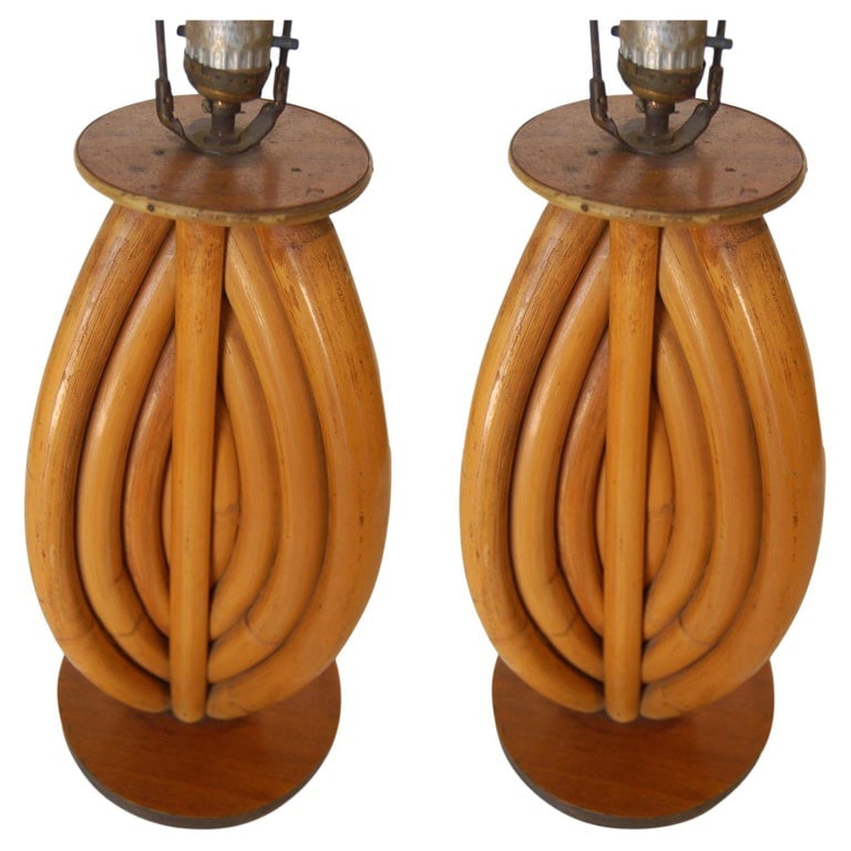 Restored Rattan Table Lamps W/ Tri-Shape Loop Pattern & Mahogany Base, Pair: Pair of restored rattan table lamps featuring tri-shape decorative pattern rattan fixed to a Mahogany base with a mahogany top cap. 1950, United States We only purchase and sell only the best and