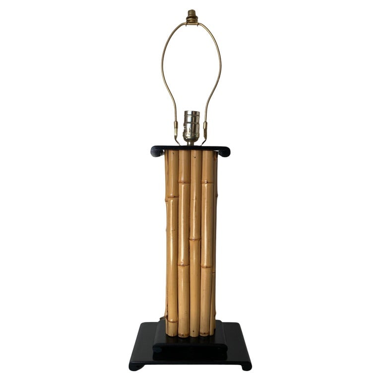 Wrapped Rattan Pole Lamp W/ Black Demi Base: Vertically stacked rattan pole lamp with black lacquer demi mahogany base and top cap piece. Wire for standard 120v North American plugs. 1950, United States We only purchase and sell the best and fin