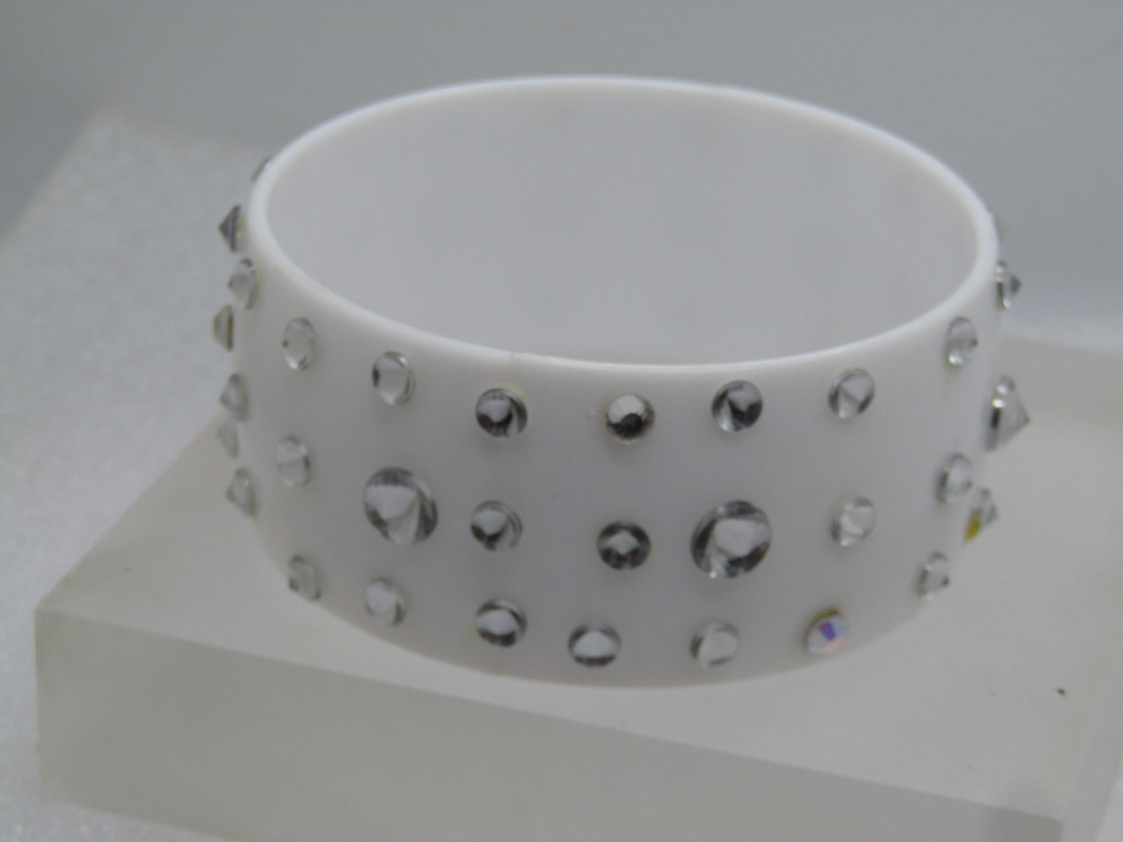 Vintage Wide White Lucite Bangle Bracelet, Clear Rhinestones, 8.5", 1980's: Title: Vintage Wide White Lucite Bangle Bracelet, Clear Rhinestones, 8.5", 1980's Description: Vintage Wide White Lucite Bangle Bracelet, Clear Rhinestones, 8.5". 8" opening. 1980's. White 1-1/3" wide