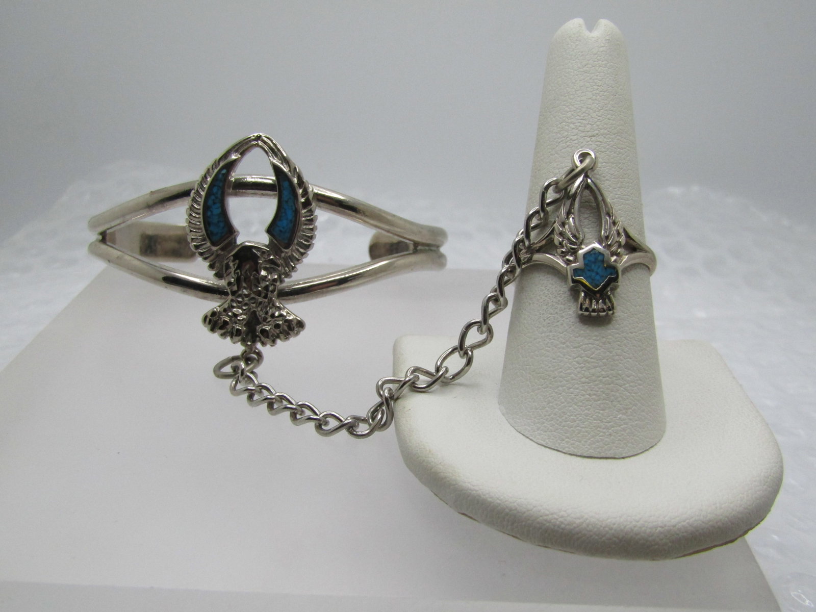 Turquoise Chip Biker Bracelet with Attached Ring, 7" and Ring is Sz. 9: Title: Turquoise Chip Biker Bracelet with Attached Ring, 7" and Ring is Sz. 9 Description: Turquoise Chip Biker Bracelet with Attached Ring, 7" and Ring is Sz. 9. This is made with a silver tone metal
