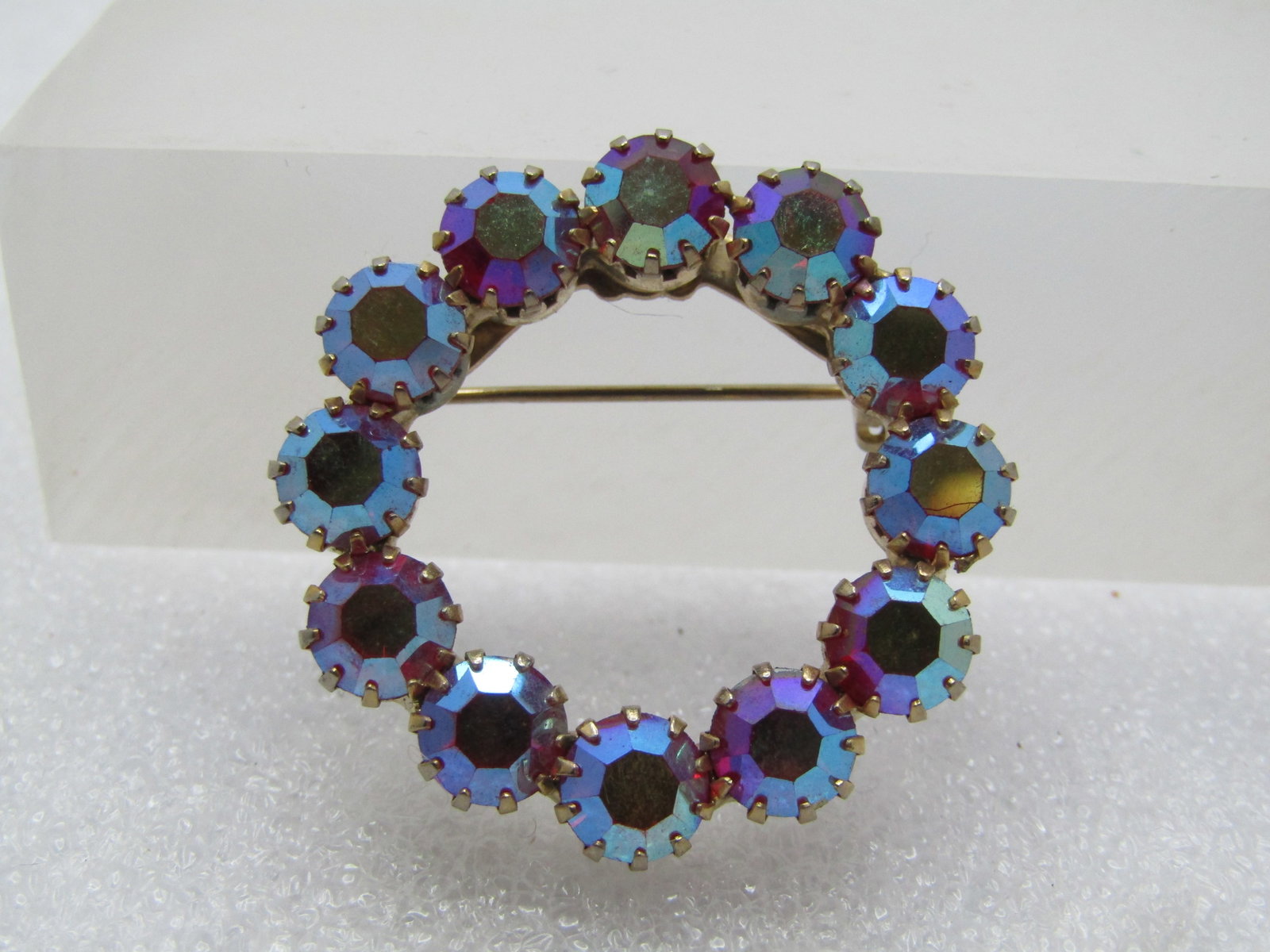 Vintage Red Aurora Borealis Rhinestone Brooch, 1960's.: Title: Vintage Red Aurora Borealis Rhinestone Brooch, 1960's. Description: Vintage Red Aurora Borealis Rhinestone Brooch, 1960's. Gold tone red 6mm AB rhinestone circle brooch. The stones are prong se