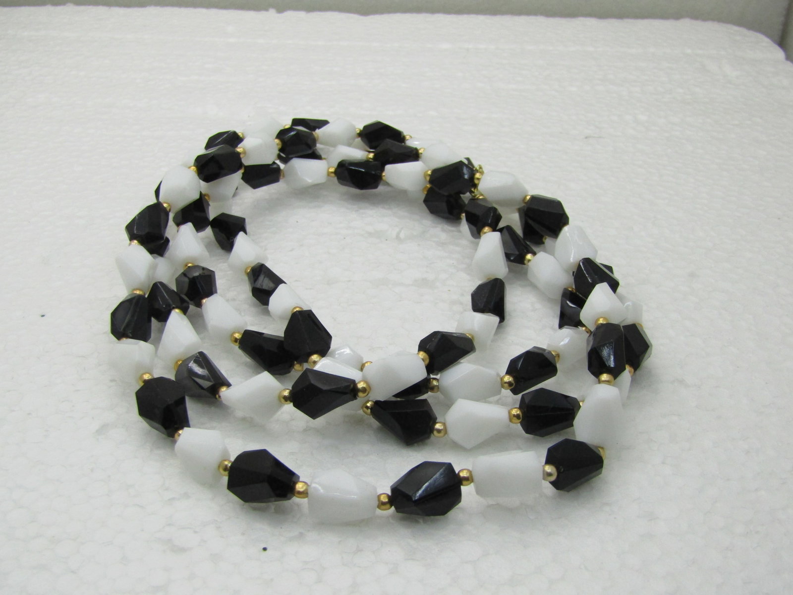 Vintage Black and White Lucite Beaded Necklace, 52", 1970's-1980's: Title: Vintage Black and White Lucite Beaded Necklace, 52", 1970's-1980's Description: Vintage Black and White Lucite Beaded Necklace, 52", 1970's-1980's. Angled beads alternating in black and white w