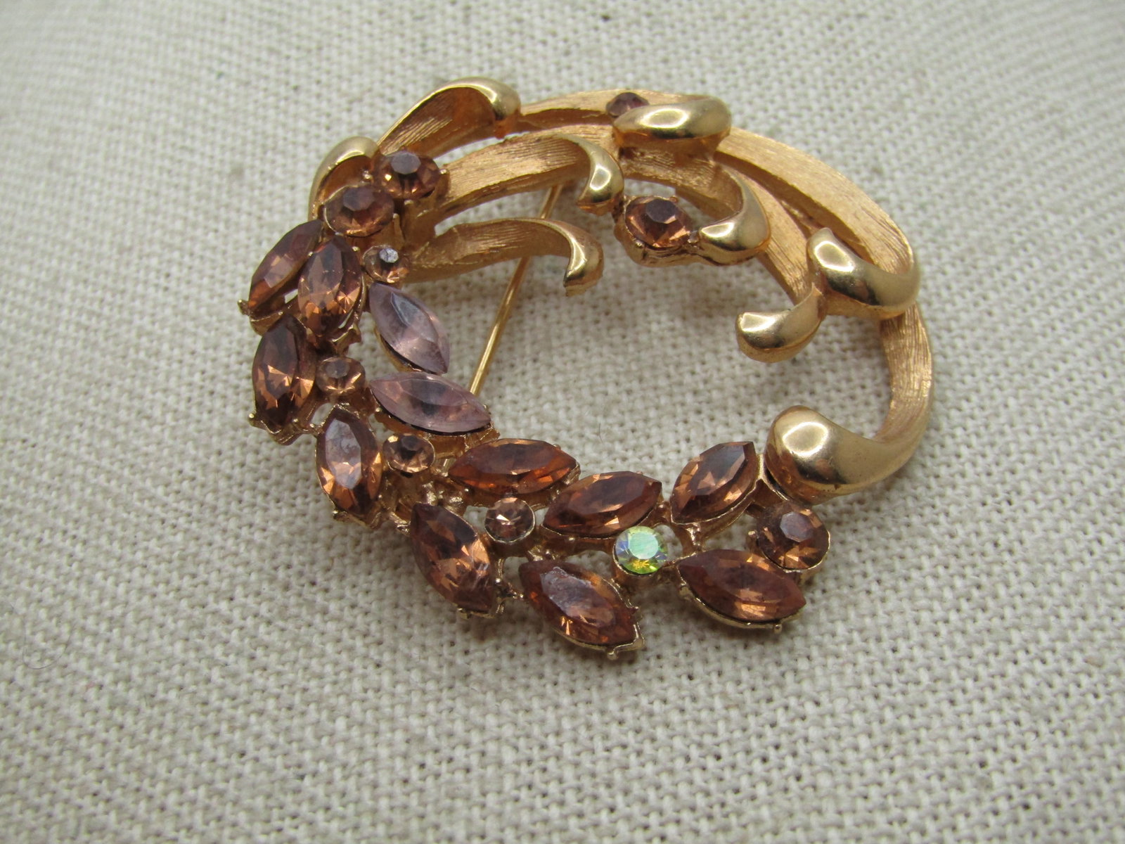 Vintage Rhinestone Scrolled Circle Brooch, Signed BSK, 1960's: Title: Vintage Rhinestone Scrolled Circle Brooch, Signed BSK, 1960's Description: Vintage Rhinestone Scrolled Circle Brooch, Signed BSK, 1960's. This is appx. 1.75" tall with curled textured and