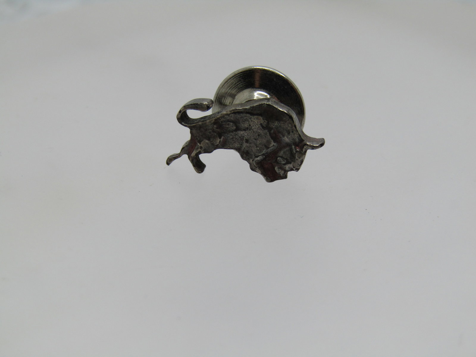 Vintage Sterling Bull Tack Pin, Signed Anson, 1960's-1970's: Title: Vintage Sterling Bull Tack Pin, Signed Anson, 1960's-1970's Description: Vintage Sterling Bull Tack Pin, Signed Anson, 1960's-1970's, 3/4" wide and 1/3" tall. Signed Anson and marked sterling. 