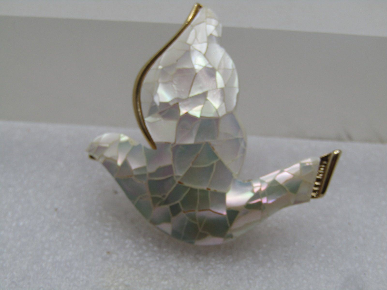 Vintage Mother-of-Pearl Dove Brooch, Liz Claiborne, 1980's-1990's: Title: Vintage Mother-of-Pearl Dove Brooch, Liz Claiborne, 1980's-1990's Description: Vintage Mother-of-Pearl Dove Brooch, Liz Claiborne, 1980's-1990's. This is a mosaic of pieces of mother-of-pearl n