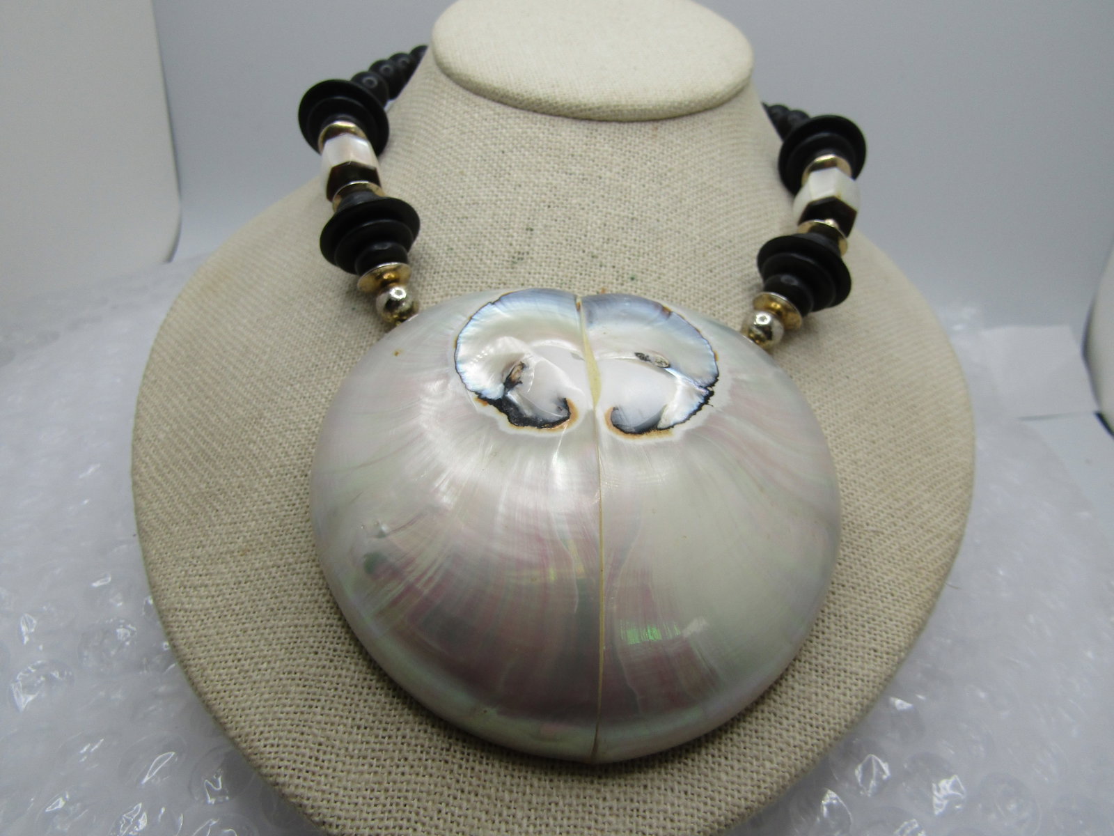 Vintage Large Shell Necklace, Black Beads, 25", Unique: Title: Vintage Large Shell Necklace, Black Beads, 25", Unique Description: Vintage Large Shell Necklace, Black Beads, 25". This has a verry puffy domed shell pendant that is appx. 3" by 3.25". It is a