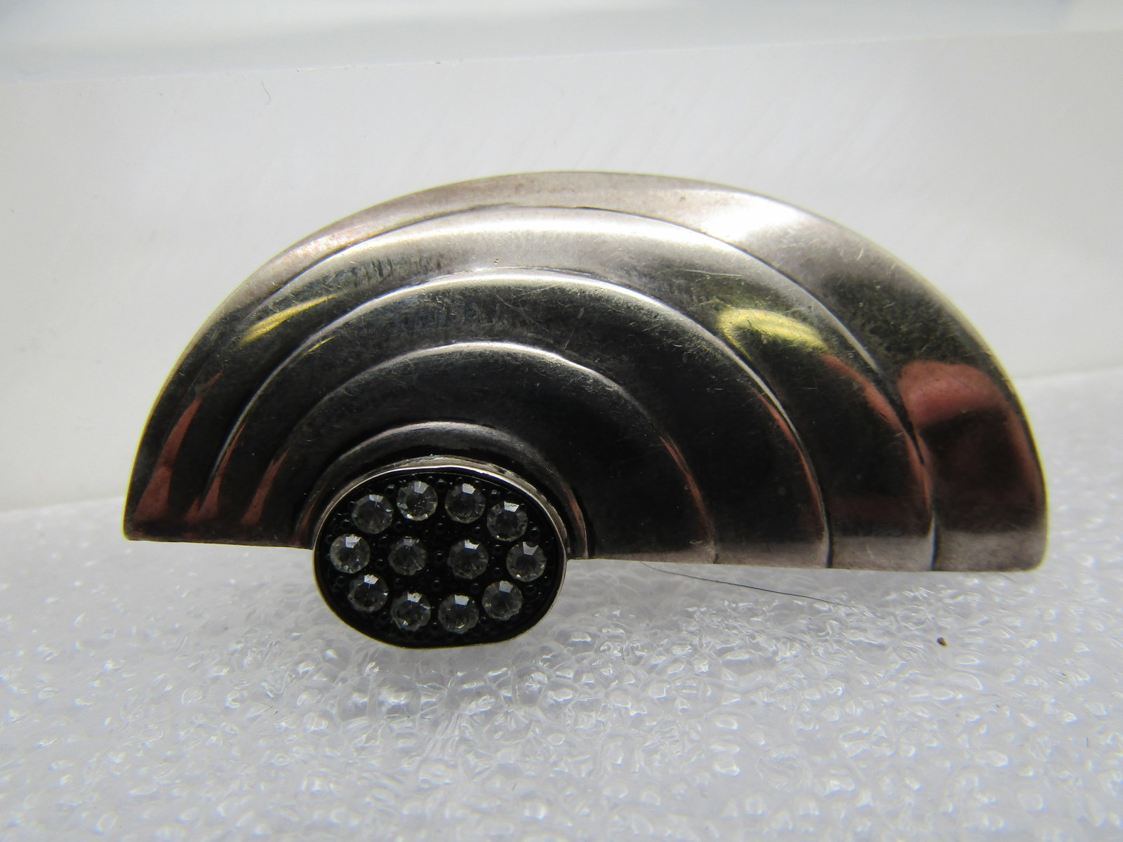 Vintage Sterling Rhinestone Mod Brooch, 1.75" by 1", 1970's-1980's: Title: Vintage Sterling Rhinestone Mod Brooch, 1.75" by 1", 1970's-1980's Description: Vintage Sterling Rhinestone Mod Brooch, 1.75" by 1", 1960's-1970's. A ridged half circle design with a raised Art