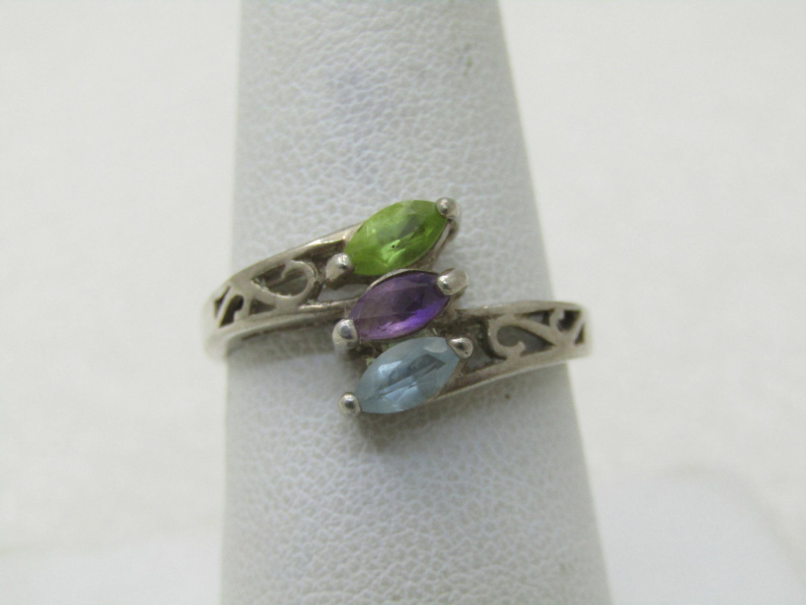 Vintage Sterling Topaz, Amethyst, Peridot Ring, Marquise, Sz. 8.5: Title: Vintage Sterling Topaz, Amethyst, Peridot Ring, Marquise, Sz. 8.5 Description: Vintage Sterling Topaz, Amethyst, Peridot Ring, Marquise, Sz. 8.5. Three stones set in a bypass band setting with