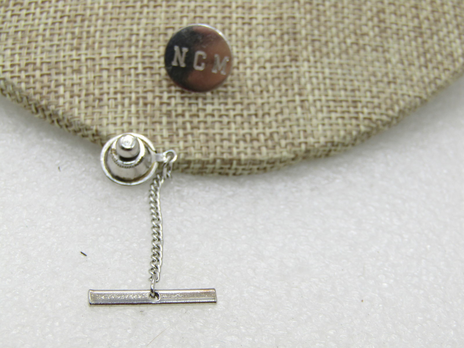 Vintage Sterling Silver N.C.M. Tack Pin, Engraved. 1/2" Circle, 1.08 Grams: Title: Vintage Sterling Silver N.C.M. Tack Pin, Engraved. 1/2" Circle, 1.08 Grams Description: Vintage Sterling Silver N.C.M. Tack Pin, Engraved. 1/2" Circle, 1.08 Grams, Post mid-century. Not signed 