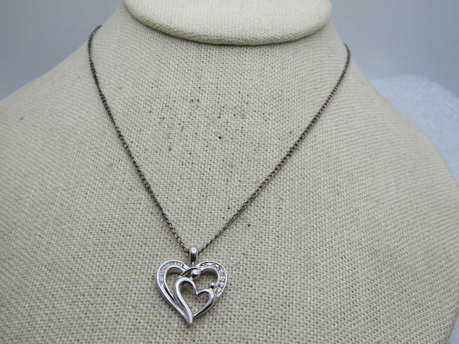 Sterling and Diamond Mother/Child Heart Necklace , 18": Title: Sterling and Diamond Mother/Child Heart Necklace , 18" Description: Sterling and Diamond Mother/Child Heart Necklace , 18". The pendant is a double heart with the outer frame having channel